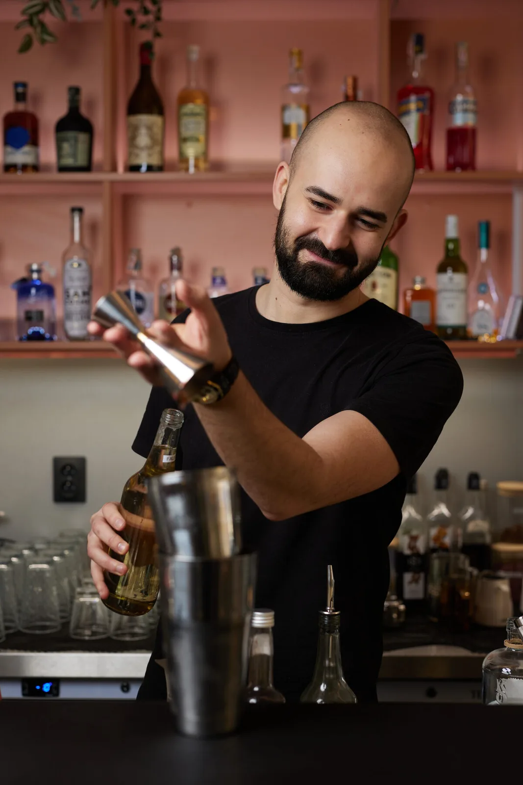 Precise bartender preparing a drink