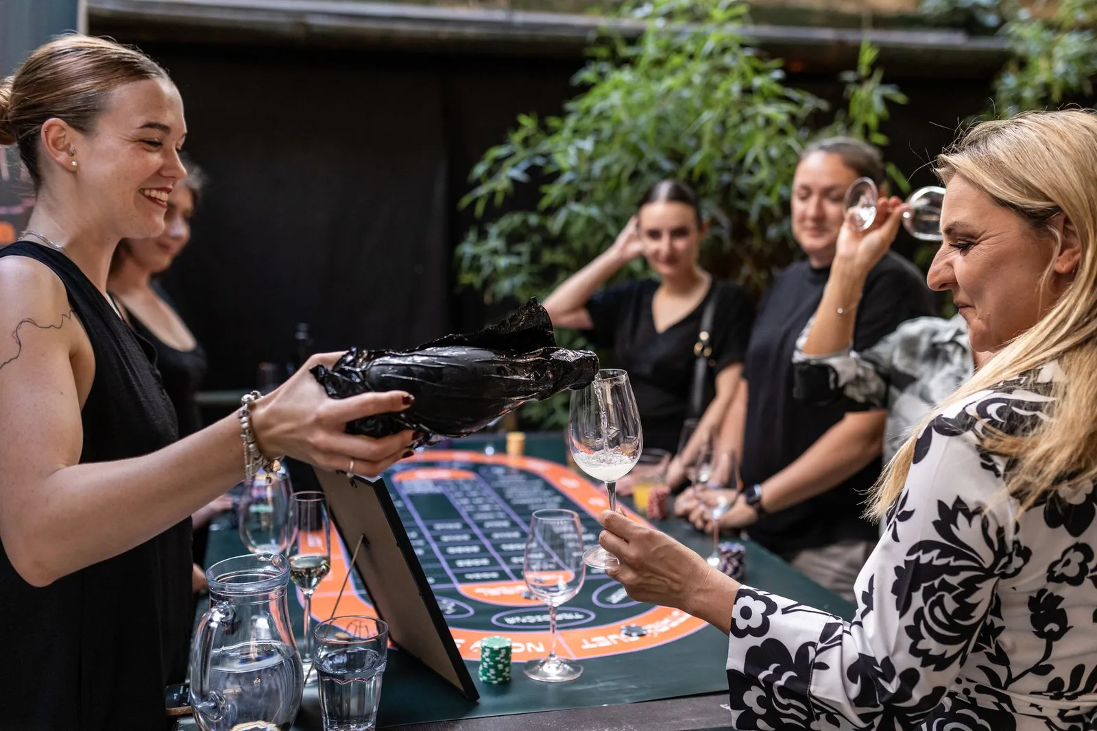 Guests betting with chips at the gaming table